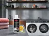 A bottle of AEG steam fragrance sits on a counter next to folded towels, a lemon, and a washing machine in the background. Produktbild-Vorschau