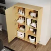 A wooden cabinet with open doors, displaying various decorative items on its shelves. Produktbild-Vorschau