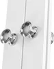 A close-up view of two silver-colored knobs on a white cabinet. Náhled obrázku produktu