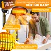 A father is tending to his baby near an infrared heater. Produktbild-Vorschau