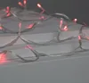 A close-up of a string of red LED lights. Produktbild-Vorschau