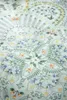 A close-up view of a light blue Pip Studio bedding set with a floral mandala pattern. Produktbild-Vorschau