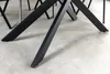Close-up of the black metal legs of a dining table. Produktbild-Vorschau
