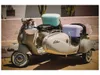 A vintage scooter with a sidecar, parked outdoors. Podgląd zdjęcia produktu