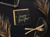A New Year's Eve table setting with black and gold themed napkins, plates, and cutlery, accented with gold palm leaves. Produktbild-Vorschau