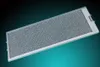 A rectangular metal mesh filter with a silver-colored frame is presented against a dark, gradient background. Produktbild-Vorschau
