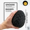 A hand holding a black, textured egg-shaped object, with text overlays describing its size and superiority. Produktbild-Vorschau