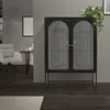 A black display cabinet with glass doors and arched details, placed in a modern living room setting. Náhľad obrázku produktu