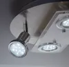 A close-up view of a modern ceiling light fixture with multiple LED spotlights. Náhled obrázku produktu
