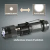 A black flashlight is shown with diagrams illustrating its zoom function and light modes. Produktbild-Vorschau