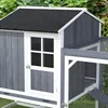 A close-up view of a wooden chicken coop with a gray exterior and a black roof. Produktbild-Vorschau