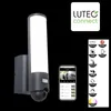 A wall-mounted outdoor light with an integrated camera and motion sensor, shown with a smartphone displaying the camera feed and a graphic detailing its features. Produktbild-Vorschau