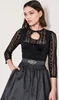 A woman wearing a black dirndl. Produktbild-Vorschau