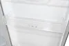 Close-up of an empty clear plastic shelf inside a refrigerator. Produktbild-Vorschau