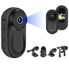 A collage of a small black camera and its accessories, with a blue light beam emanating from the lens. Produktbild-Vorschau