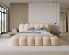 A modern bedroom with a large bed. Voir les images du produit