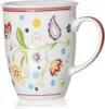 A white ceramic mug with a floral and paisley pattern. Náhľad obrázku produktu