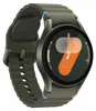 A smartwatch with a green band and a dark gray casing is shown against a light gray background. The watch face displays a colorful graphic and step count. Produktbild-Vorschau