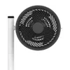 A close-up studio shot of a black and white fan. Voir les images du produit