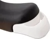 A close-up view of a black bicycle seat with a white plastic handle underneath. Náhled obrázku produktu