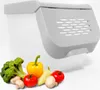 A white storage container with a gray lid, positioned behind a selection of fresh vegetables including broccoli, bell peppers, tomatoes, and mushrooms. Voir les images du produit
