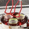 A jar lifter is used to remove jars from a pot of boiling water. Anteprima dell’immagine prodotto
