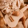 Drewniana gitara dla dzieci - ukulele - kolor różowy Podgląd zdjęcia produktu 5