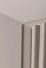 A close-up view of the corner of a beige cabinet, showing the fluted detail on the side. Náhľad obrázku produktu