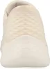 A close-up, front view of a beige Skechers sneaker. Náhľad obrázku produktu