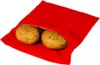 Two potatoes are partially visible inside a red fabric bag. Produktbild-Vorschau