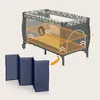 A baby crib with an overlay highlighting different levels and a separate foldable mat. Produktbild-Vorschau