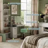 A bedroom scene featuring a vanity table with LED lights, a stool, and shelves, with a bed in the foreground. Anteprima dell’immagine prodotto