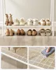 A shoe rack displaying various types of shoes and the rack's structure. Produktbild-Vorschau