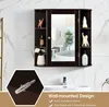 A bathroom vanity with a medicine cabinet, sink, and faucet, decorated with various items. Produktbild-Vorschau