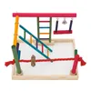 A colorful bird playground with ladders, a swing, and a rope, set on a white background within a wooden tray. Náhled obrázku produktu