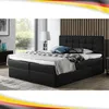 A black boxspring bed with a tufted headboard is shown in a bedroom setting. Produktbild-Vorschau