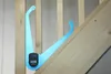 A blue digital measuring caliper is placed on a wooden staircase. Produktbild-Vorschau
