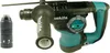 A Makita HR2811FT Kombihammer with an accessory is shown against a white background. Podgląd zdjęcia produktu