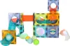 A magnetic marble run toy set with various transparent and colored pieces, including slides, tubes, and balls, arranged on a white background. Anteprima dell’immagine prodotto