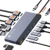 A docking station with various cables and adapters arranged around it. Produktbild-Vorschau