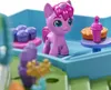 A close-up of a toy playset with a pink pony figure, cupcakes, and a pie. Produktbild-Vorschau