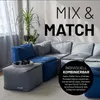 A modular sofa system in a living room setting with plants. Produktbild-Vorschau