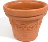 A terracotta flower pot with embossed floral designs. Anteprima dell’immagine prodotto