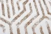 A close-up view of a textured rug with a geometric pattern. Náhled obrázku produktu