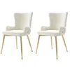 Two beige dining chairs with gold legs are shown against a white background. Anteprima dell’immagine prodotto