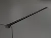 A black shower screen support bar mounted on a gray wall. Produktbild-Vorschau
