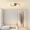 A modern living room with a sectional sofa and a unique ceiling light. Náhled obrázku produktu