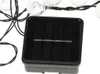 A close-up shot of a solar panel connected to a string of lights. Náhľad obrázku produktu