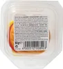 A clear, top-down view of a plastic container holding a multi-layered gummy candy shaped like a burger. Produktbild-Vorschau