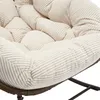 Close-up of a beige corduroy cushion on a rattan chair. Anteprima dell’immagine prodotto